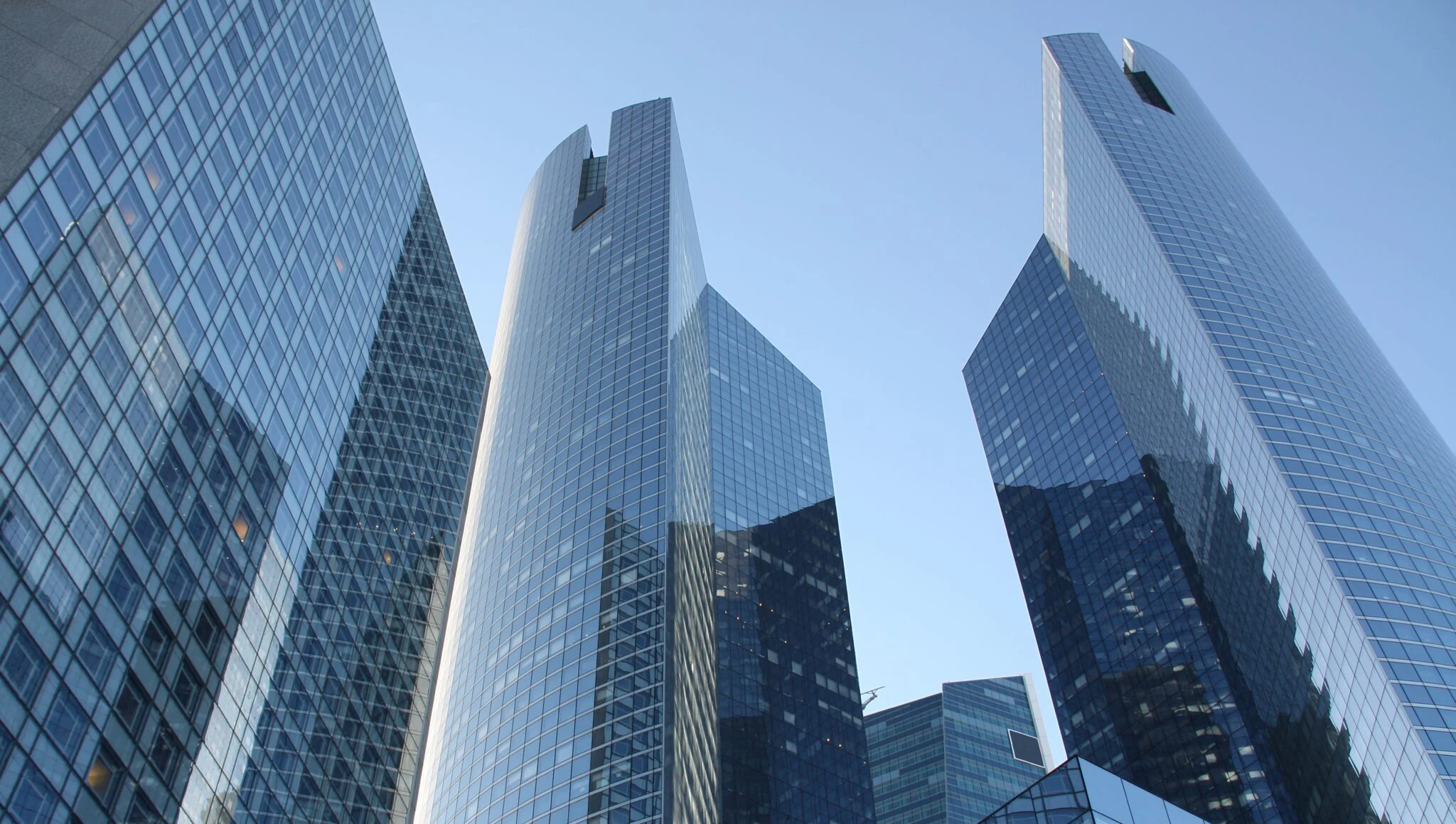 High-rise buildings with glass facades from a worm's-eye view in the financial district